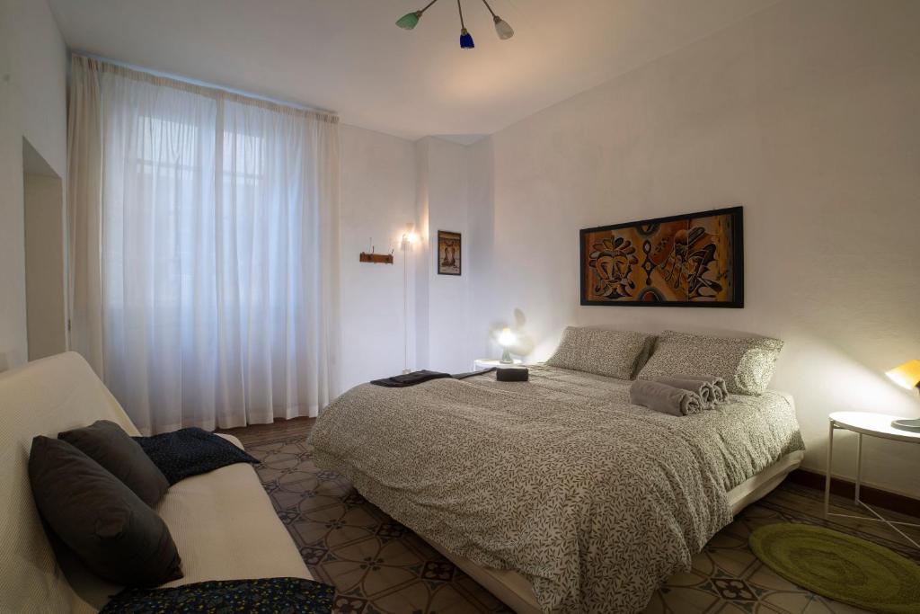 Postelja oz. postelje v sobi nastanitve Oasi nel Cuore di Lucca, super centrale e luminoso