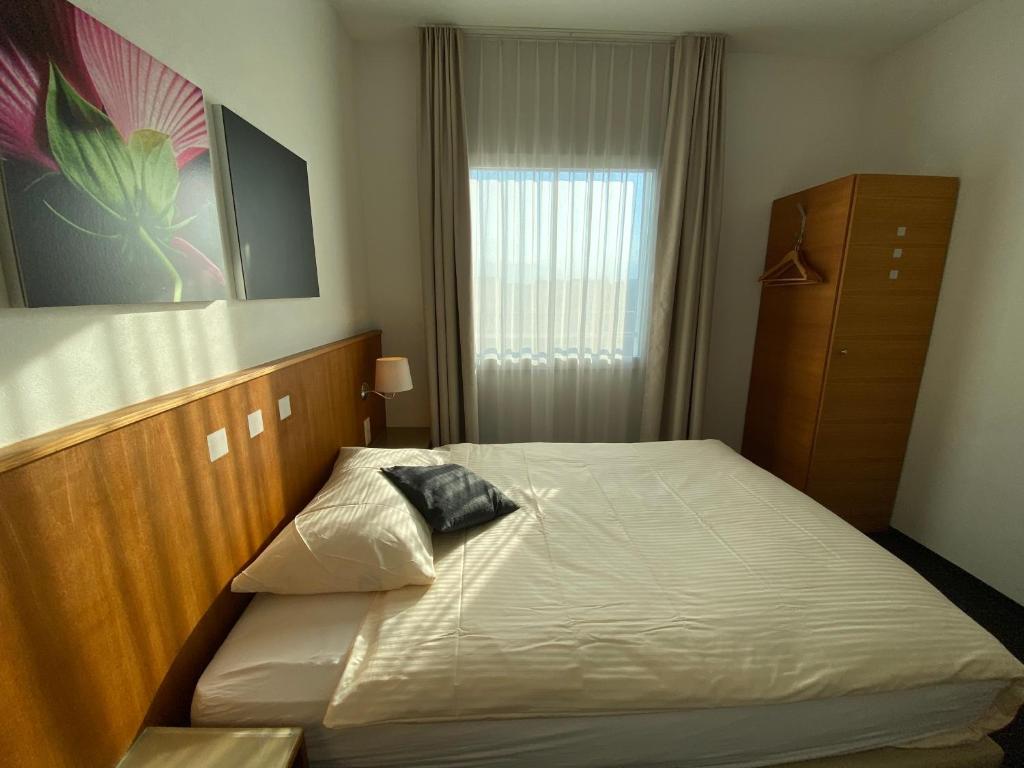 Postel nebo postele na pokoji v ubytování Businesshotel Lux
