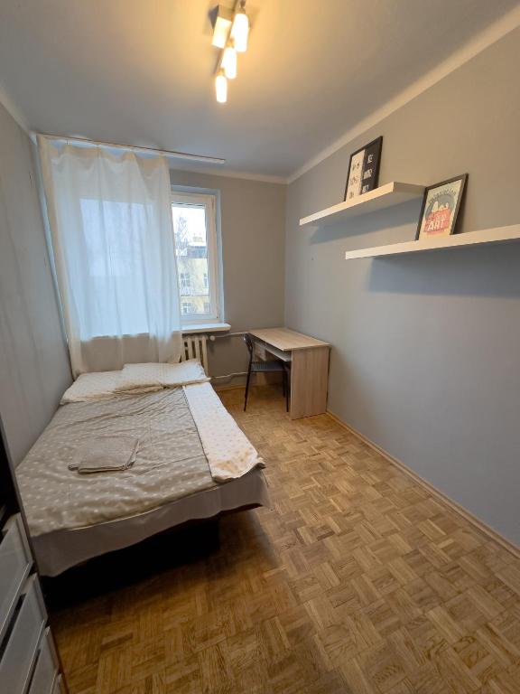 Posteľ alebo postele v izbe v ubytovaní Kwadrat B&B Jałowego