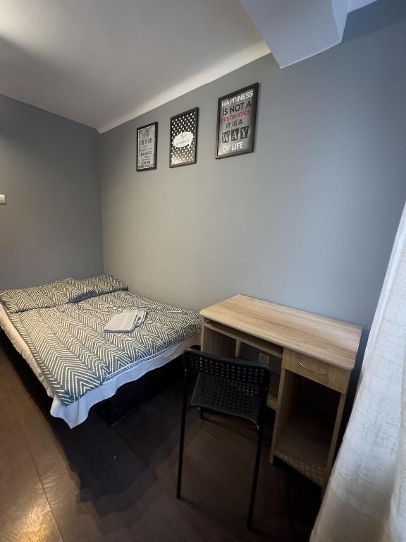 Posteľ alebo postele v izbe v ubytovaní Kwadrat B&B Jałowego