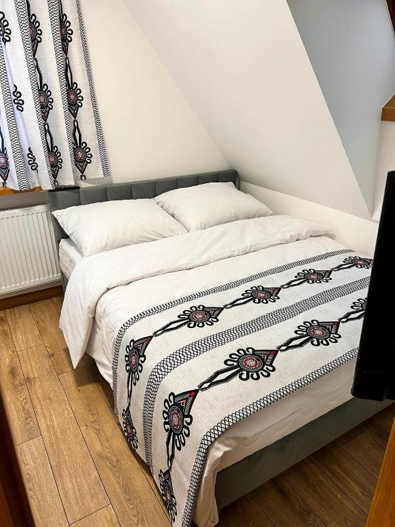 Postel nebo postele na pokoji v ubytování Willa Nosalowa Dolina