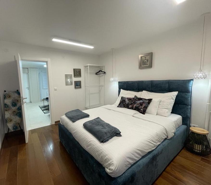 a bedroom with a large bed with pillows on it at NBG113 apartment in Belgrade