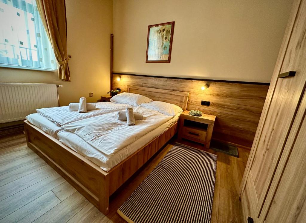 Postel nebo postele na pokoji v ubytování Penzion Manderlak