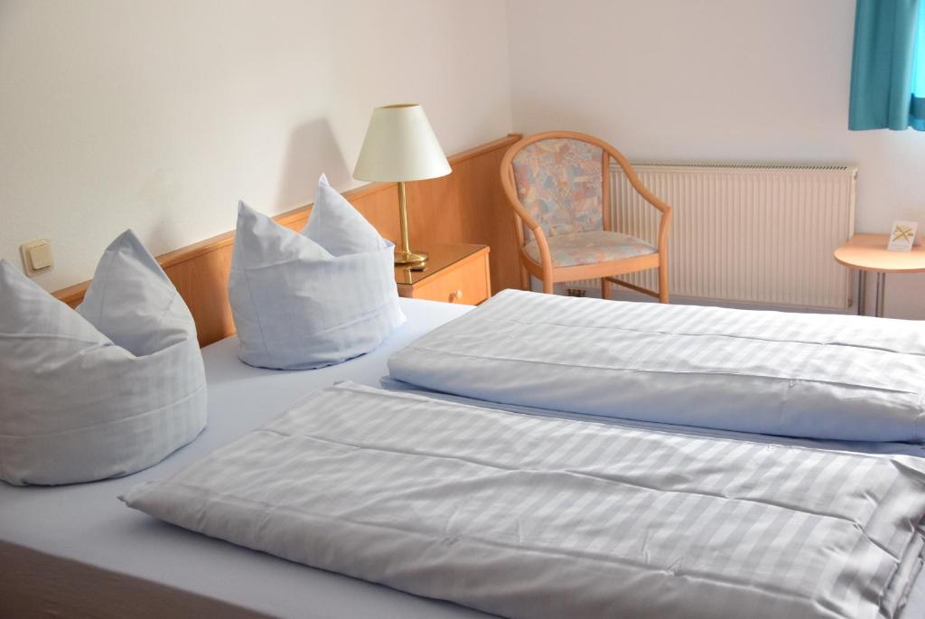 Postel nebo postele na pokoji v ubytování Niebuhrs Hotel