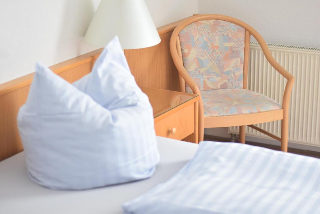 Postel nebo postele na pokoji v ubytování Niebuhrs Hotel