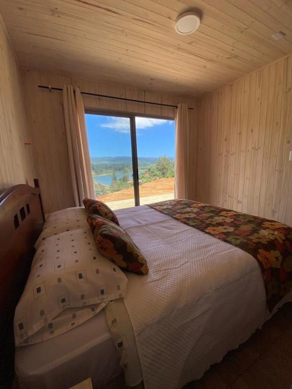 Postel nebo postele na pokoji v ubytování Cabaña gam.nav