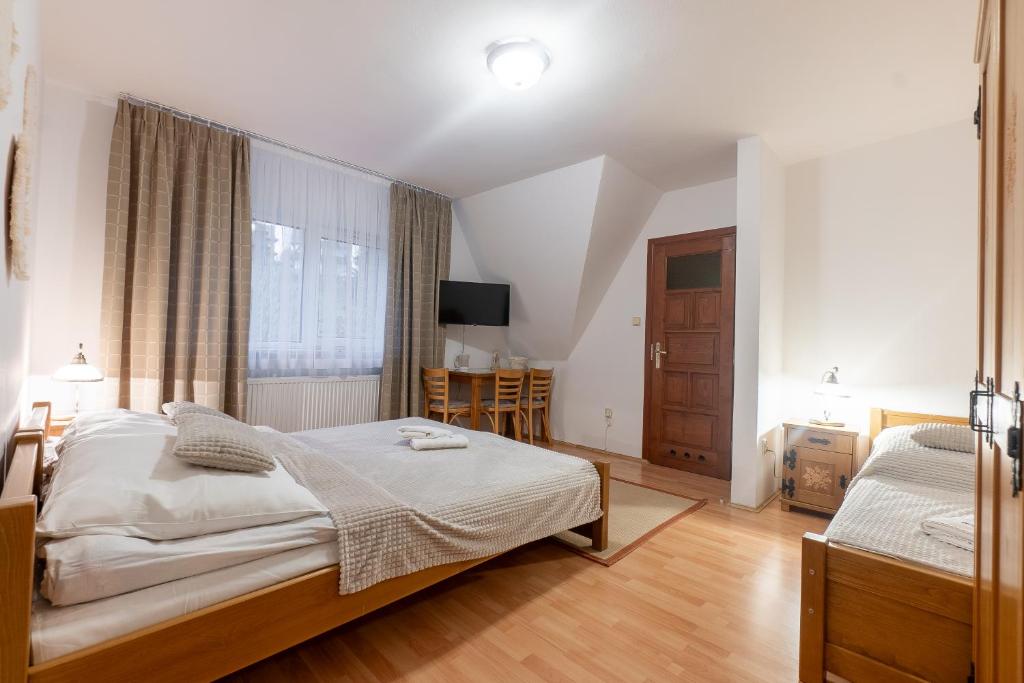 Posteľ alebo postele v izbe v ubytovaní 9 Sił Murowany Dom