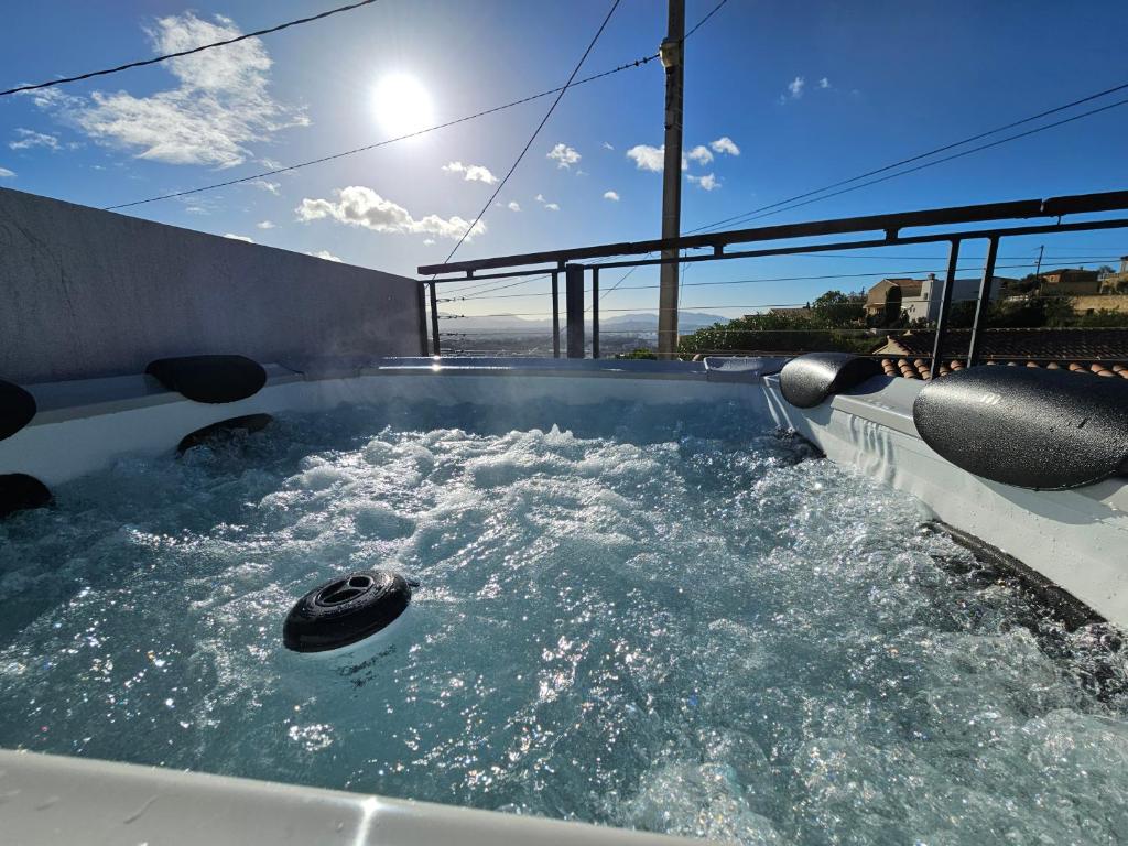 a hot tub with water and a wheel in it at Bella Piscine in Marseille