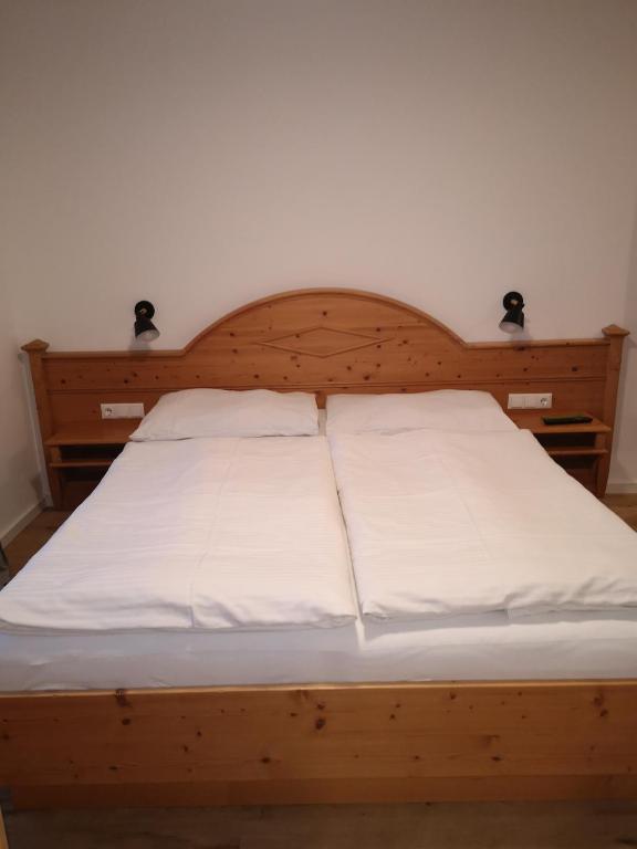 Posteľ alebo postele v izbe v ubytovaní Haus Grugger Appartements
