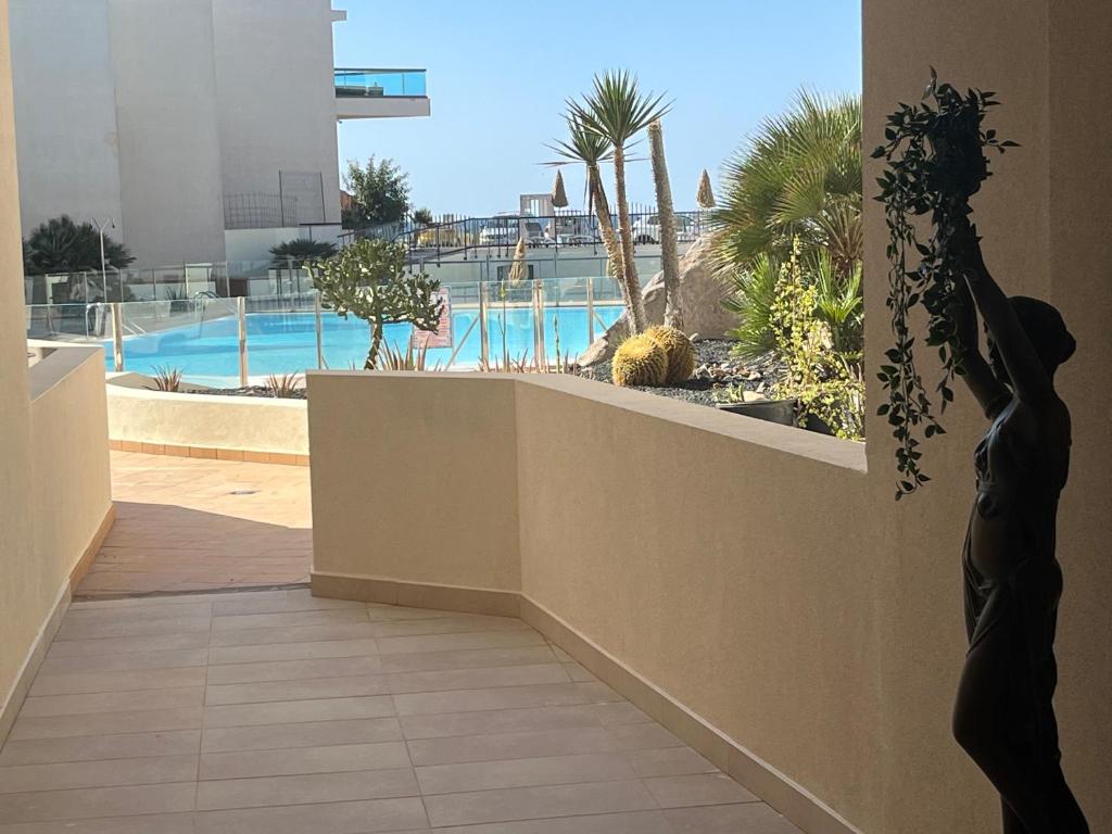 a balcony with a view of a swimming pool at Casa Teri - Los Lagos in El Cotillo