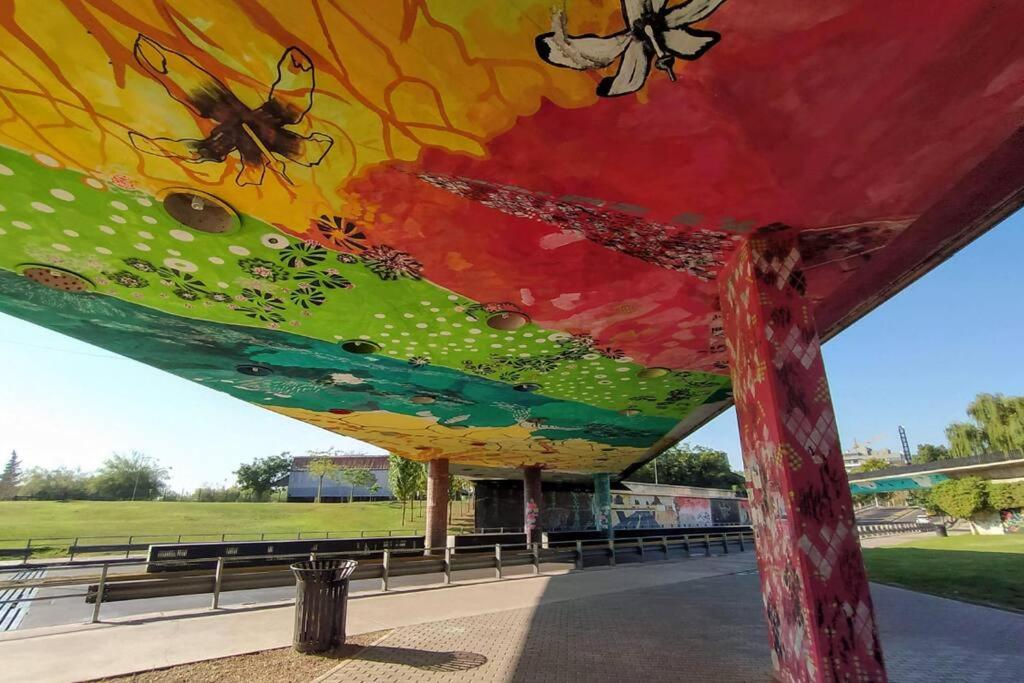 a mural of insects on the underside of a building at VENDIMIADORES, departamento con vista en Mendoza in La Cieneguita
