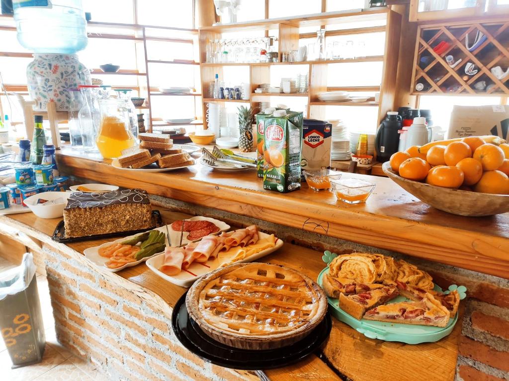a buffet with a lot of food on a table at Cabañas Santa Maria Pucon in Pucón