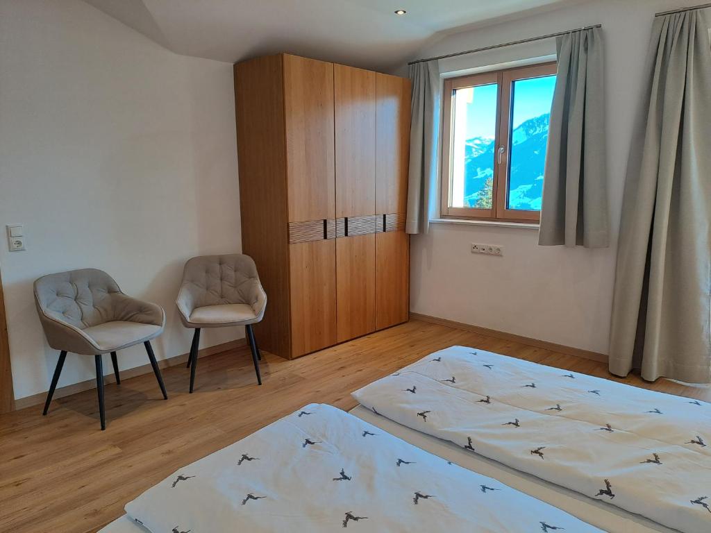 Postel nebo postele na pokoji v ubytování Sonnseit Appartement