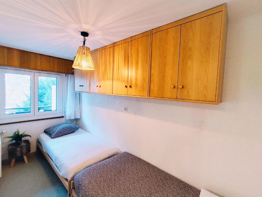 Postel nebo postele na pokoji v ubytování NA ''Chalet'' au Centre et Parking Couvert GRATUIT
