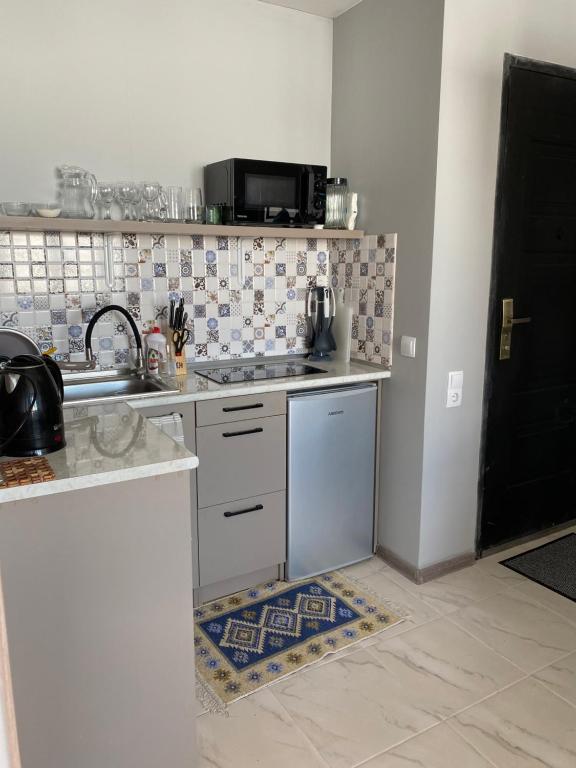 Kuchyň nebo kuchyňský kout v ubytování 2-room Apartment NFT Gudauri Penta 701