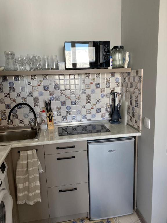 Kuchyň nebo kuchyňský kout v ubytování 2-room Apartment NFT Gudauri Penta 701