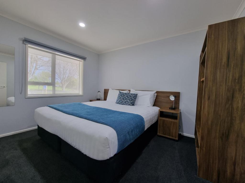 Postel nebo postele na pokoji v ubytování Antonio Mews Motel