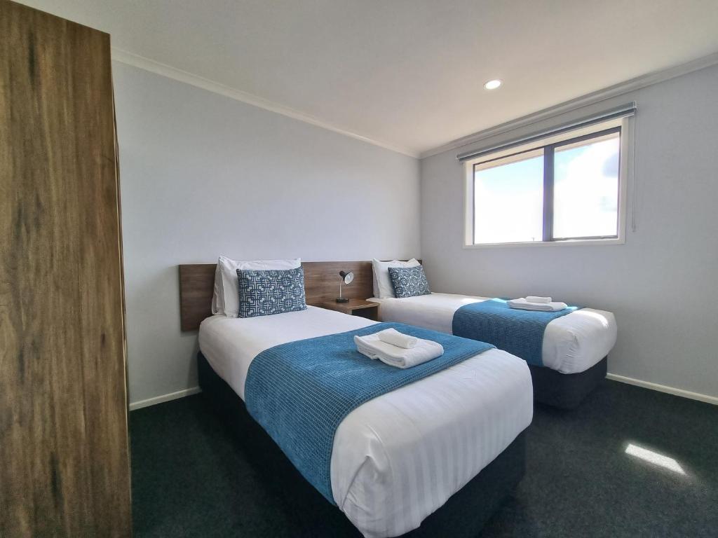 Postel nebo postele na pokoji v ubytování Antonio Mews Motel