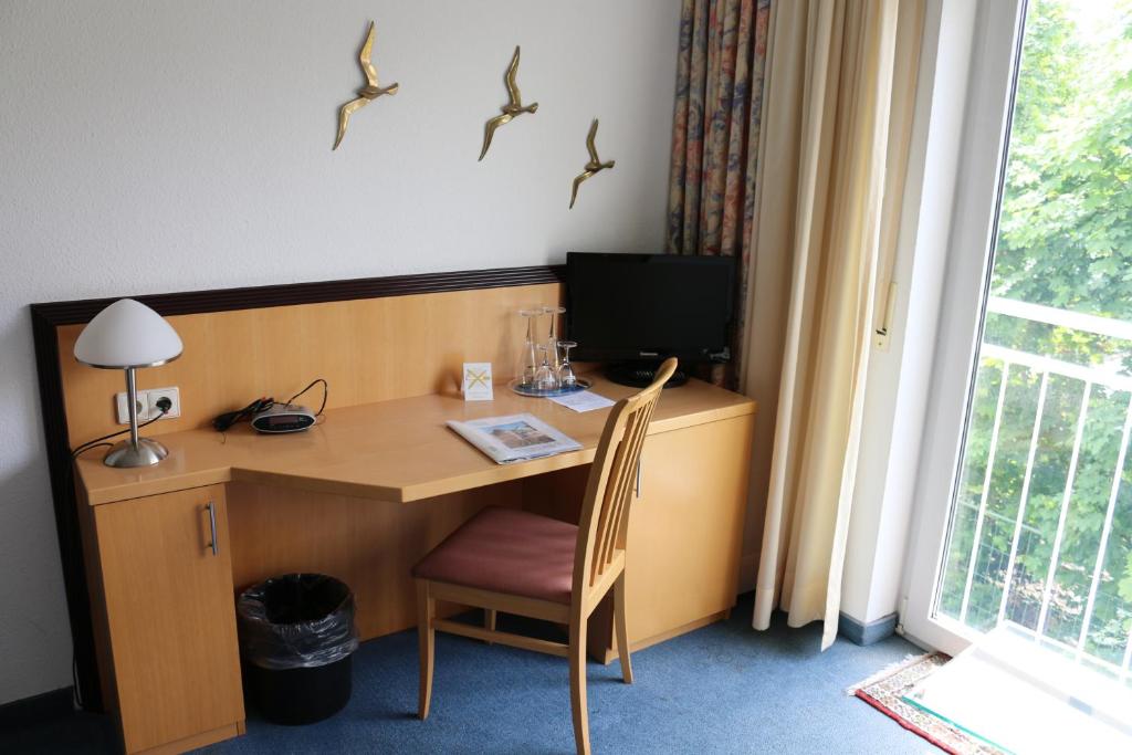 TV a/nebo společenská místnost v ubytování Hotel Torgauer Brauhof