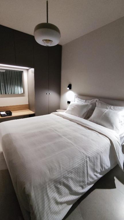Postel nebo postele na pokoji v ubytování Aillo Living Spaces