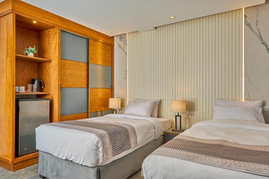 Uma cama ou camas num quarto em Khan Duidar Inn - Pyramids View Rooftop