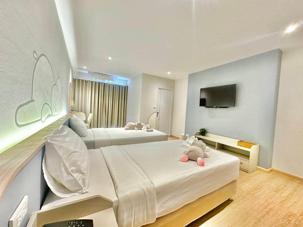 Postel nebo postele na pokoji v ubytování Herma Hotel