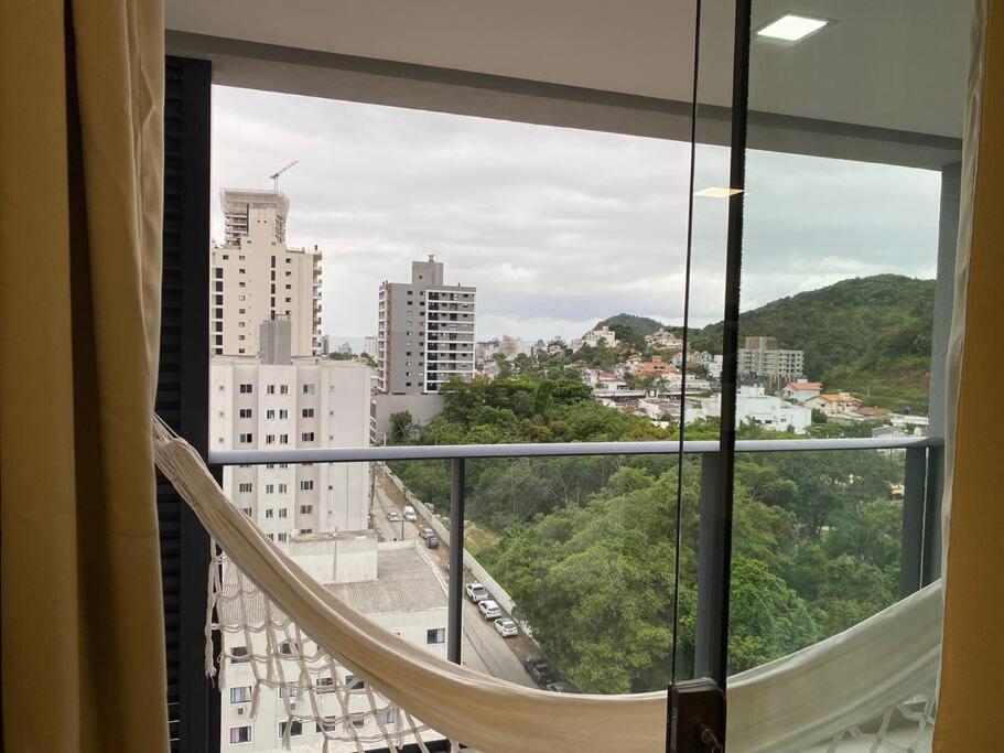 a view of a city from a window at Excelente AP (novo) Praia Brava. in Itajaí