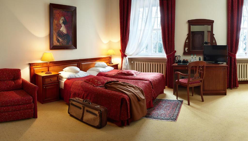 Postel nebo postele na pokoji v ubytování Zamek Na Skale