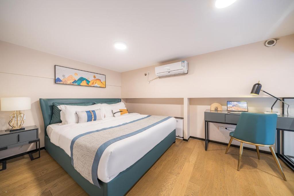 Postel nebo postele na pokoji v ubytování Gepai Executive Apartment - Shenzhen Futian Convention and Exhibition Center