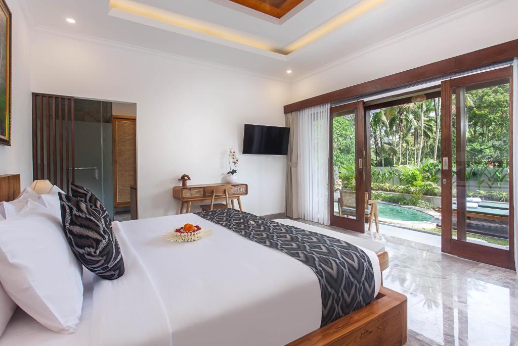 Postel nebo postele na pokoji v ubytování Arvanya Villa Ubud