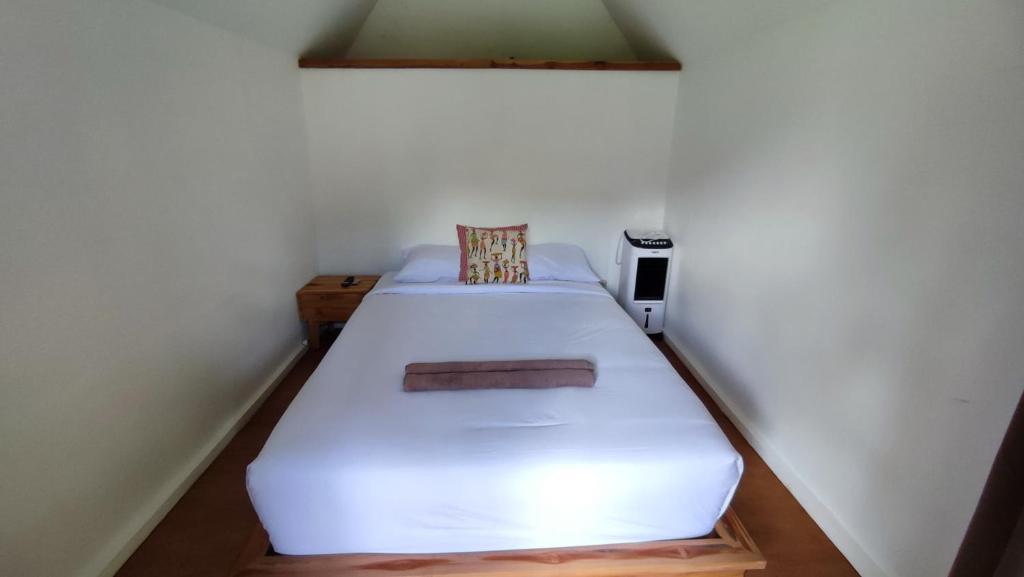 Rúm í herbergi á Sekumpul Bali Hidden Space