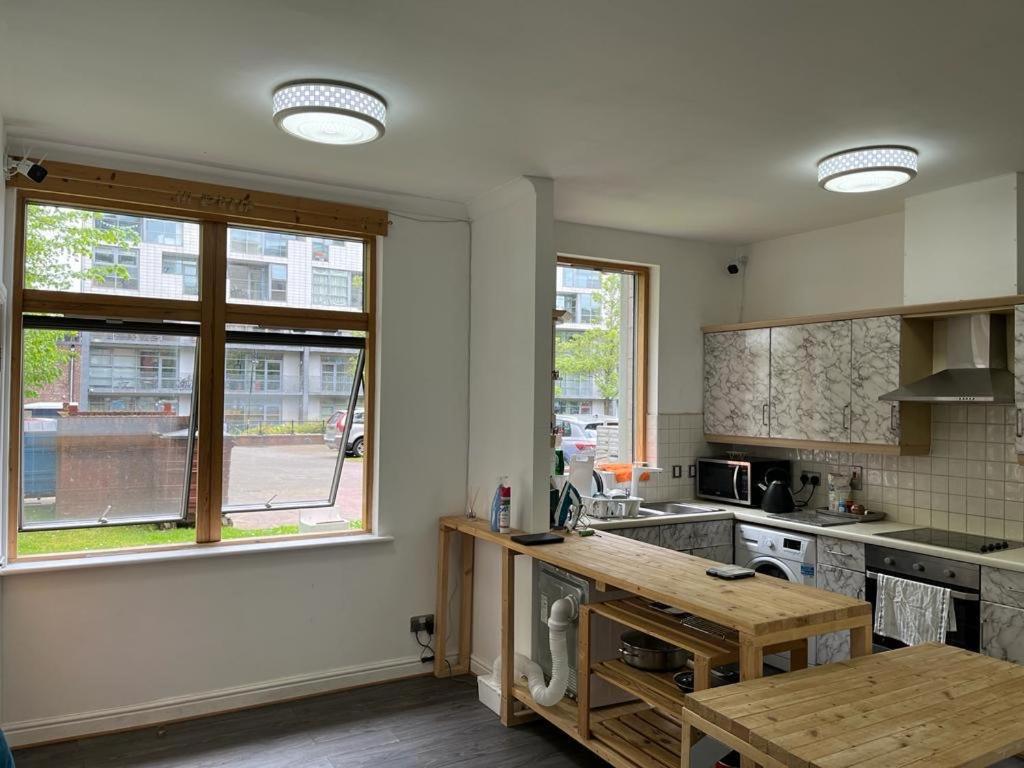 a kitchen with a table and a window in it at City Centre 1 in Manchester