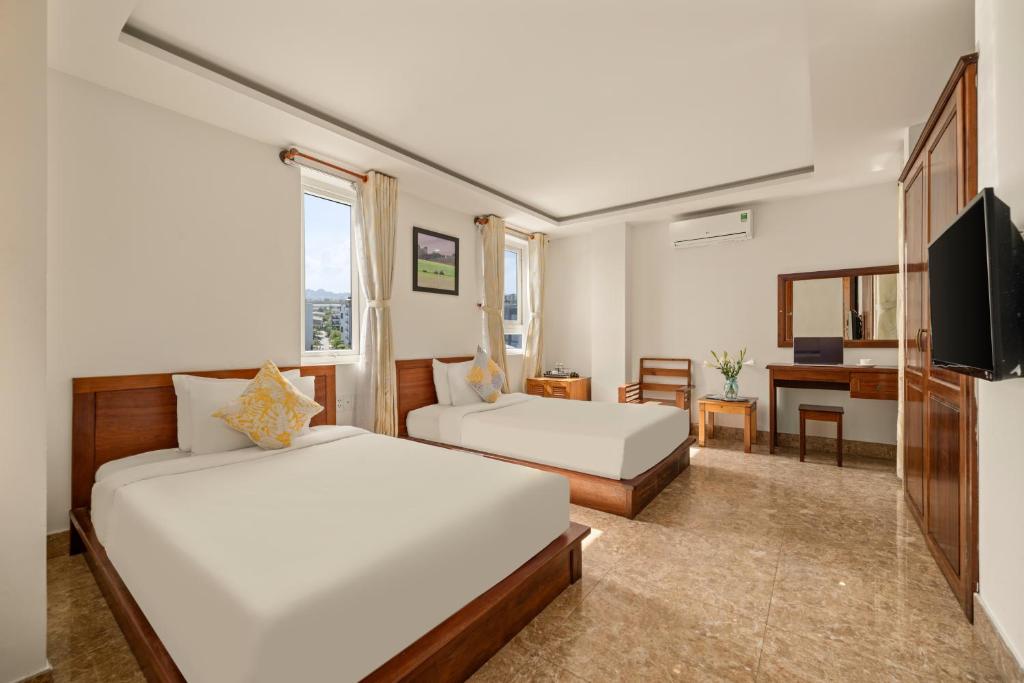 TV a/nebo společenská místnost v ubytování Titan Hotel Da Nang