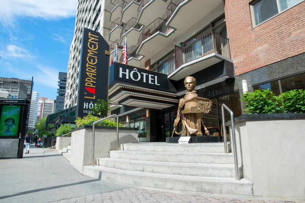 a statue of a man walking down a street at L'Appartement Hôtel in Montreal