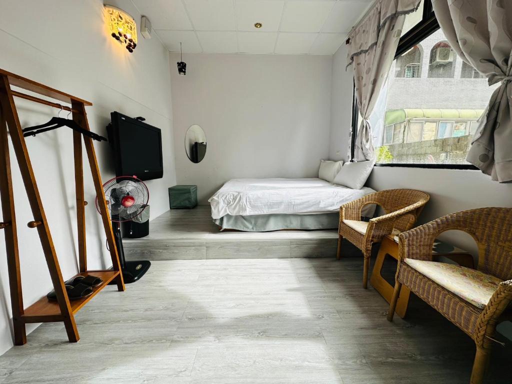 Postel nebo postele na pokoji v ubytování Zhixinyuan B&B