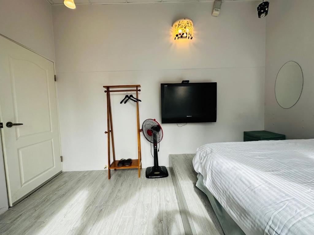 Postel nebo postele na pokoji v ubytování Zhixinyuan B&B