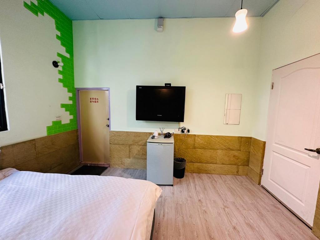 TV a/nebo společenská místnost v ubytování Zhixinyuan B&B