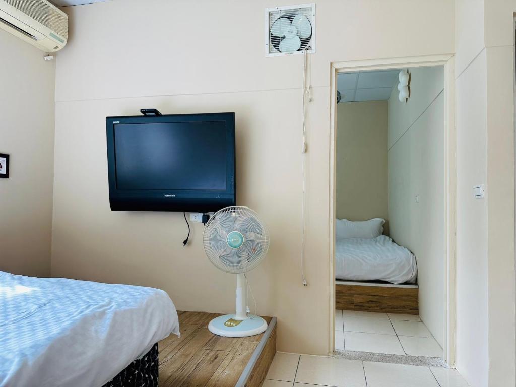 Postel nebo postele na pokoji v ubytování Zhixinyuan B&B
