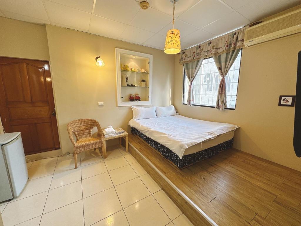 Postel nebo postele na pokoji v ubytování Zhixinyuan B&B