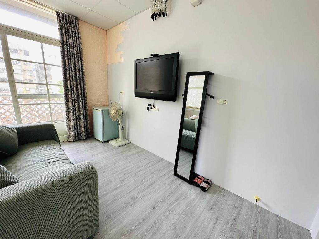 TV a/nebo společenská místnost v ubytování Zhixinyuan B&B