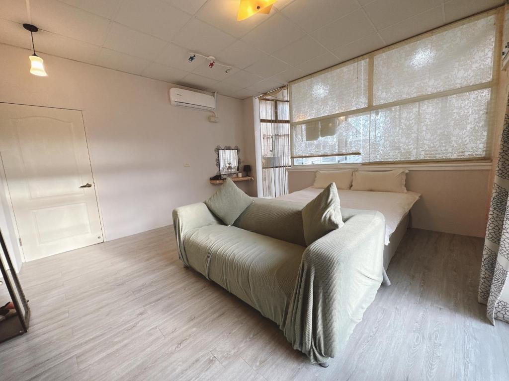 Postel nebo postele na pokoji v ubytování Zhixinyuan B&B