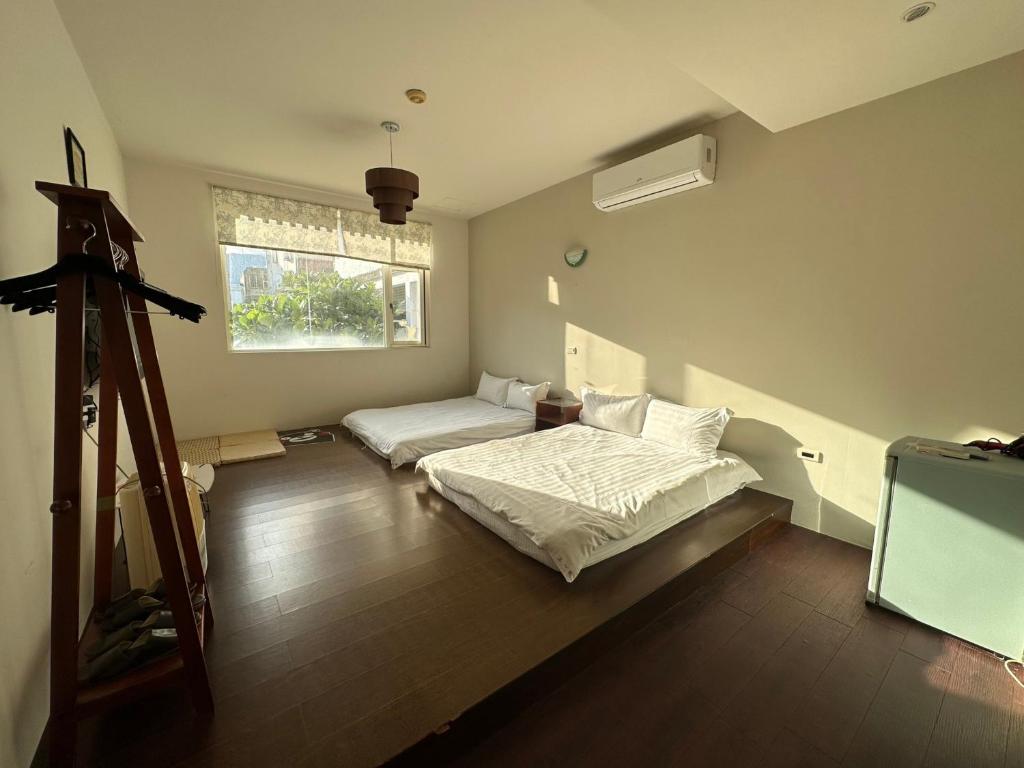 Postel nebo postele na pokoji v ubytování Zhixinyuan B&B