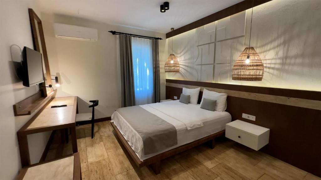 Postel nebo postele na pokoji v ubytování İskelem Otel