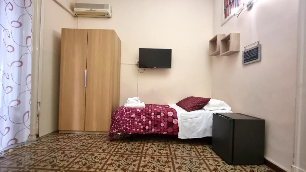 Un televizor și/sau centru de divertisment la Cortile Stesicoro