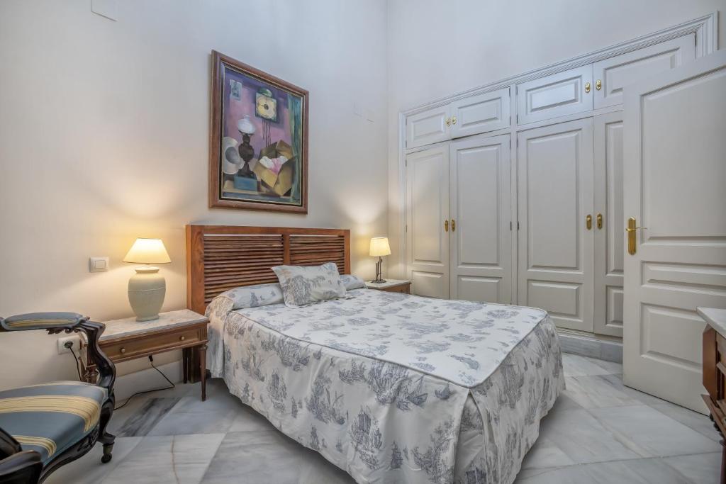 A bed or beds in a room at Palacio Marqués Vega Armijo & Parking incluido