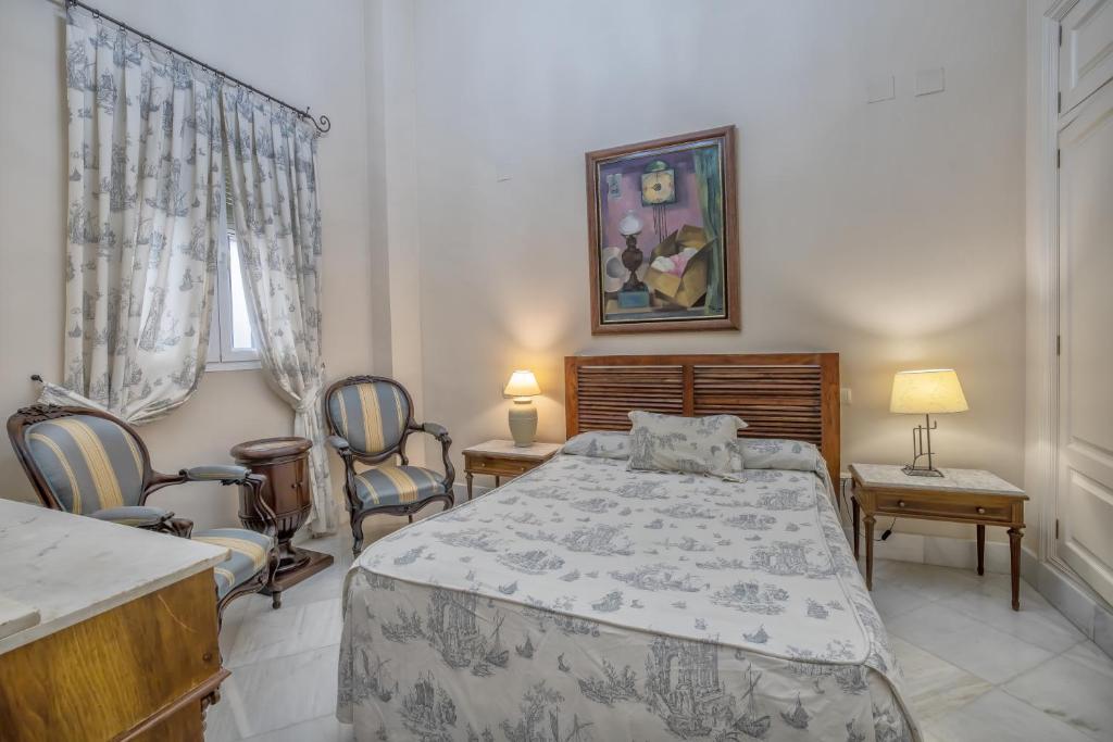 A bed or beds in a room at Palacio Marqués Vega Armijo & Parking incluido