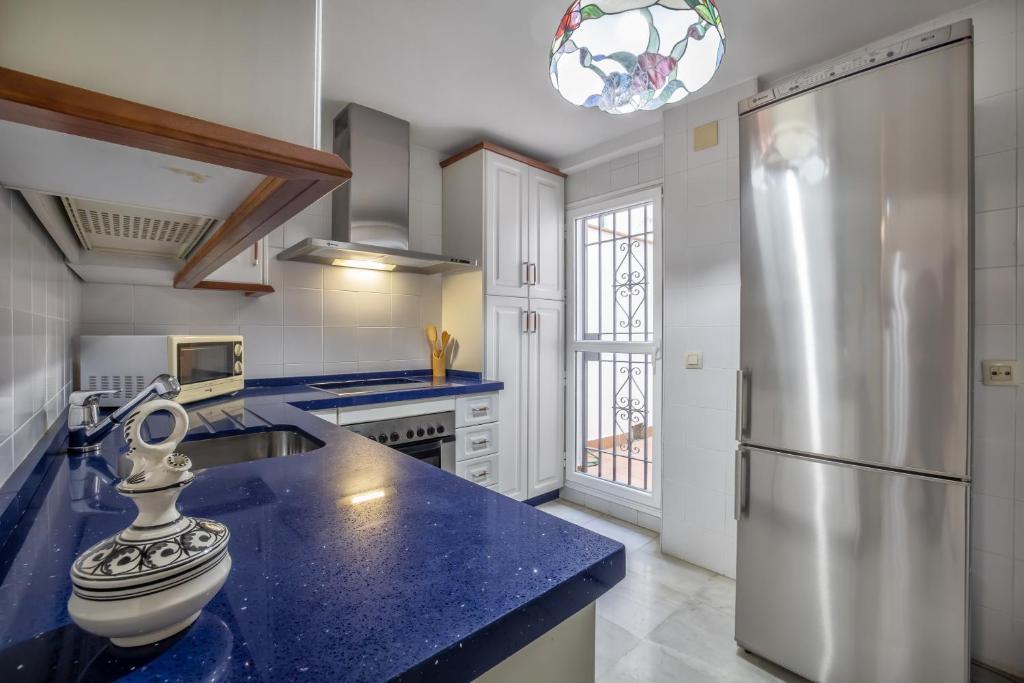 A kitchen or kitchenette at Palacio Marqués Vega Armijo & Parking incluido