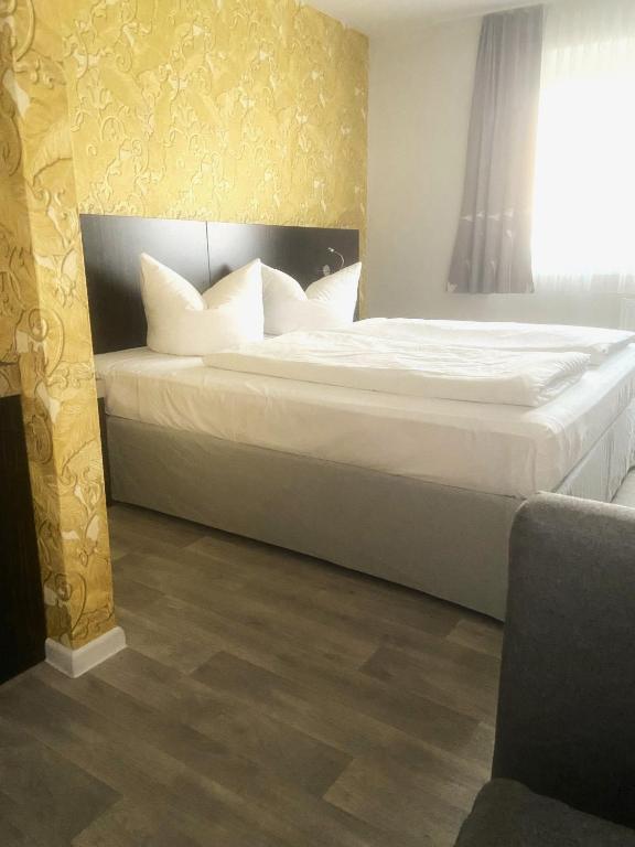 Postel nebo postele na pokoji v ubytování Hotel 22