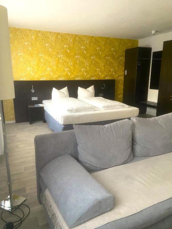 Postel nebo postele na pokoji v ubytování Hotel 22