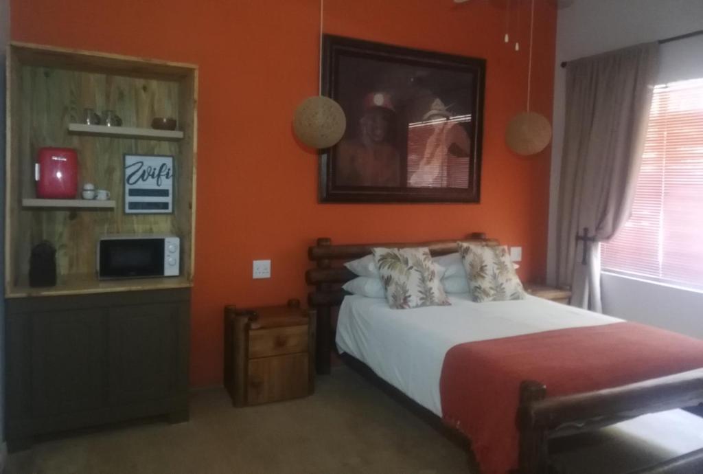 En eller flere senger på et rom på AshTree GuestHouse